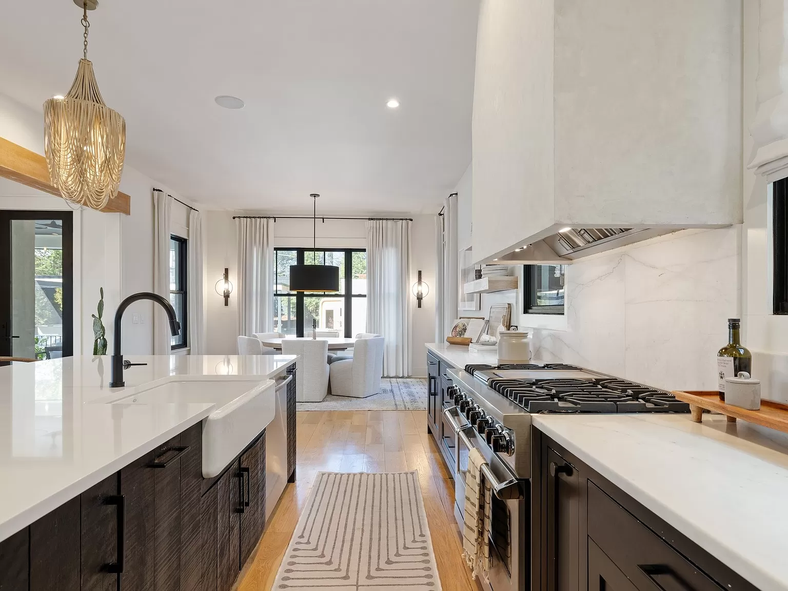 Sleek Kitchen Design with Central Island and Open Living Area View